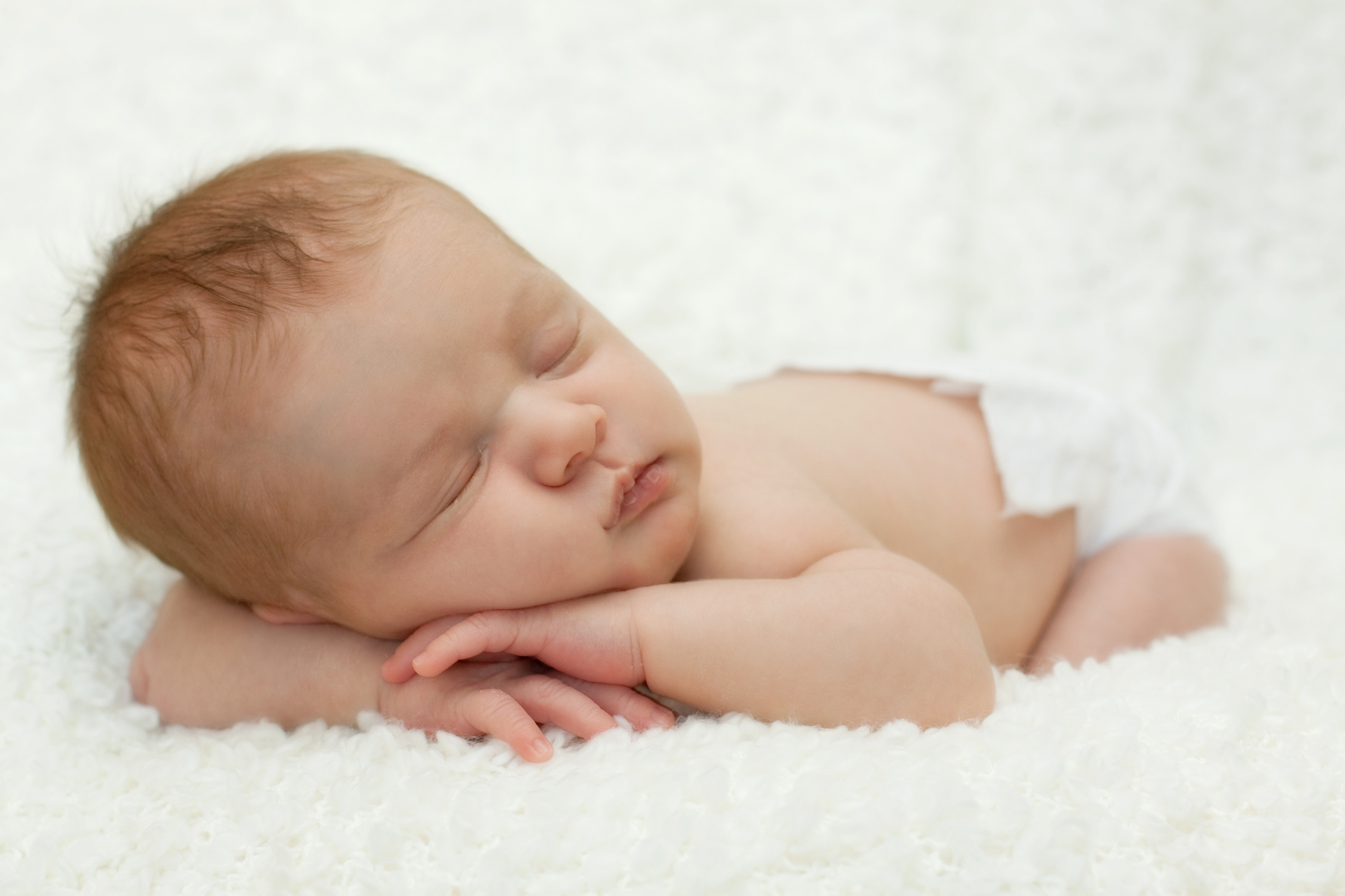 Sweet sleeping newborn baby - full length
